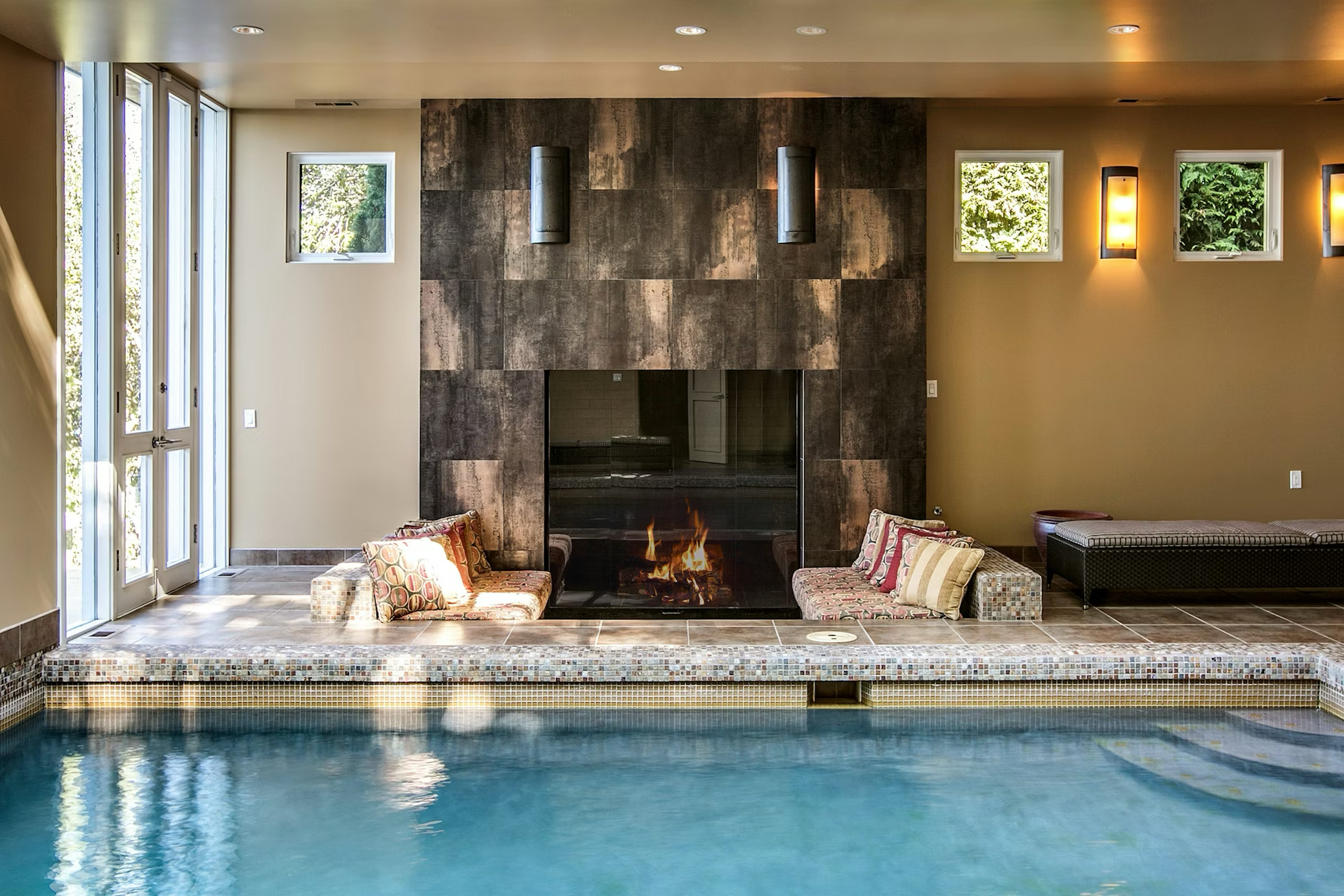 Indoor pool with fireplace